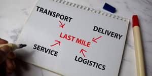 Last mile delivery written on a note book.